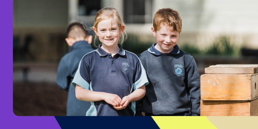 Two primary school students outdoors at school.